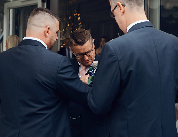 The best man chatting to guests