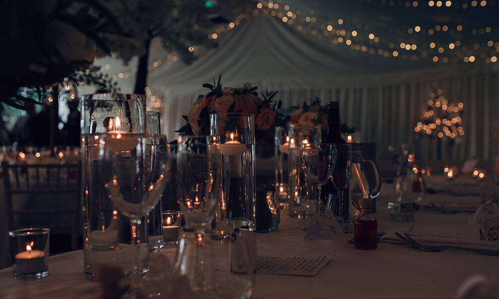 A photo of the top table with the candles lit