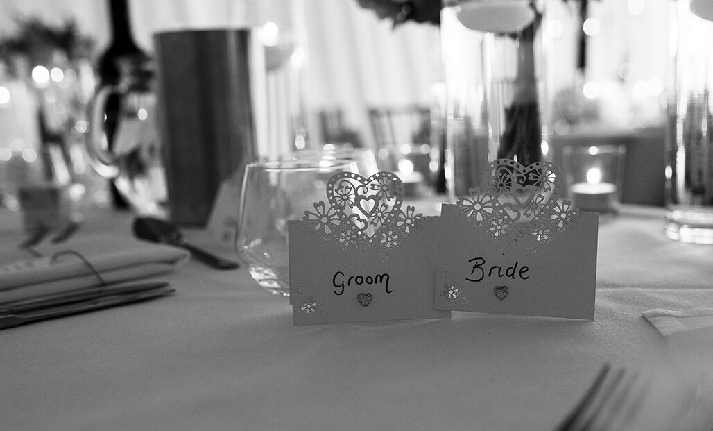 The bride and grooms place settings