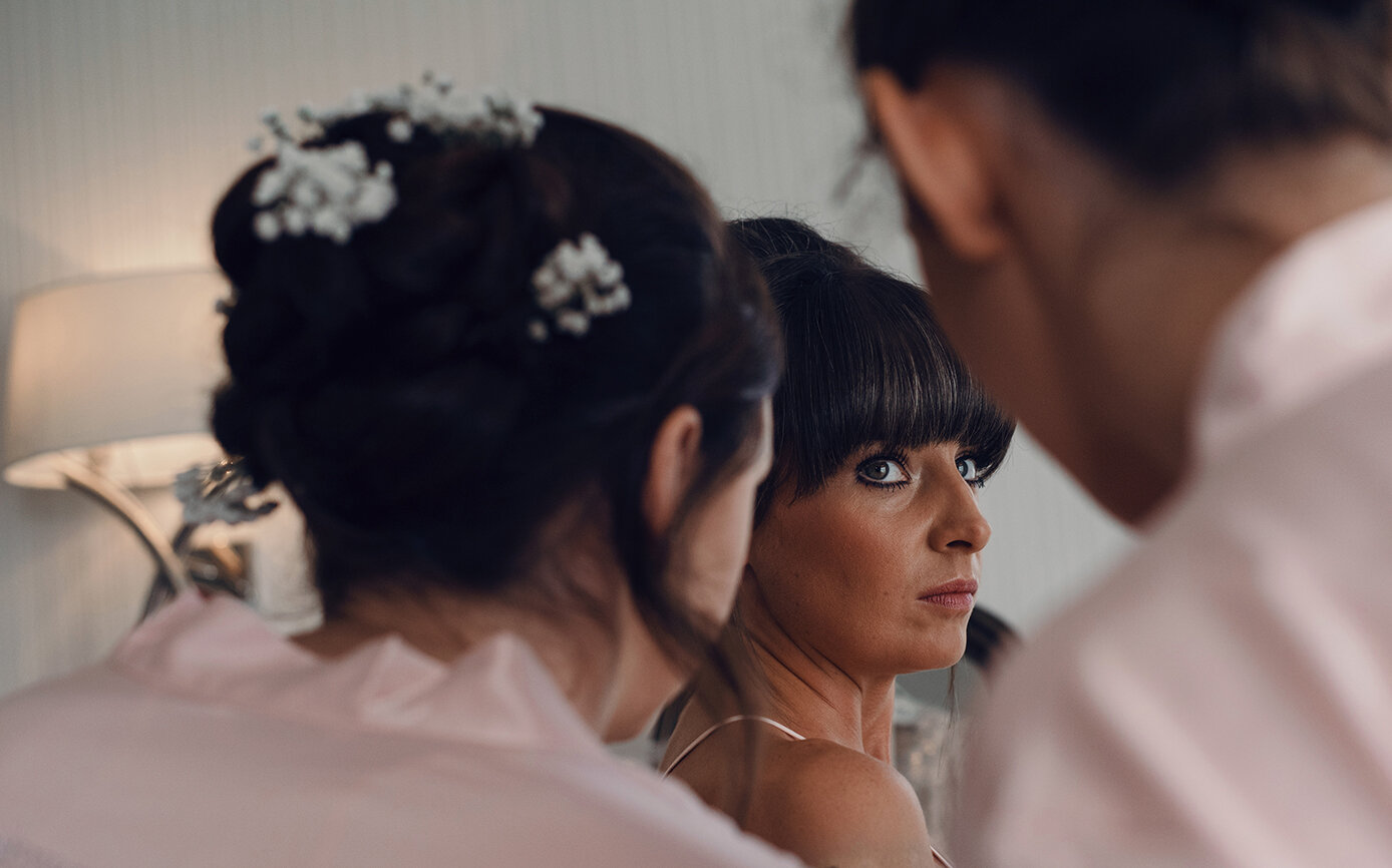 A side glance at the camera from a bridesmaid