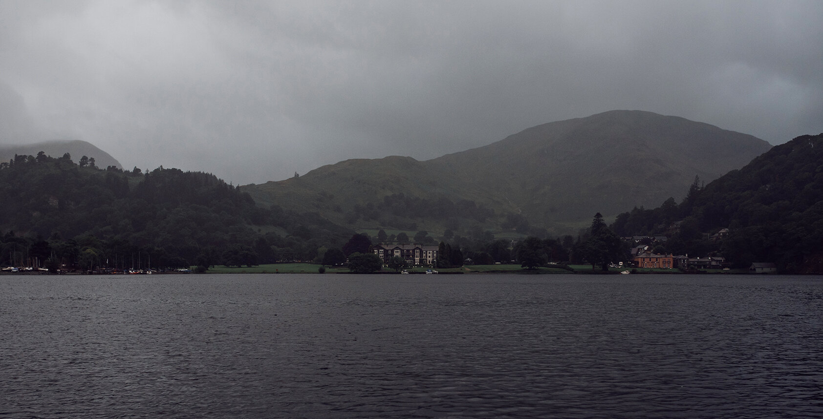 A wide angle shot of the Inn on the lake hotel from the lake steamer