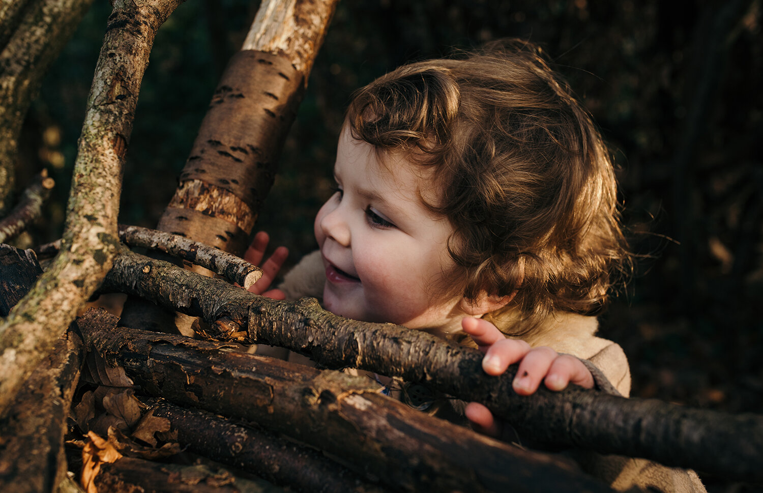 Little girl standing in the twigs