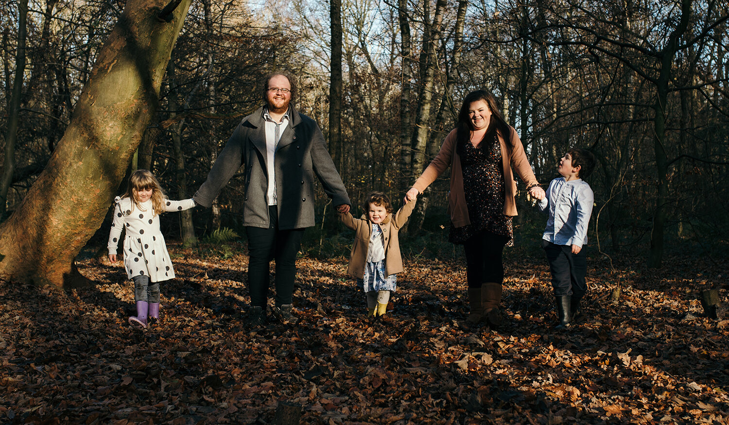 The whole family walking in the woods