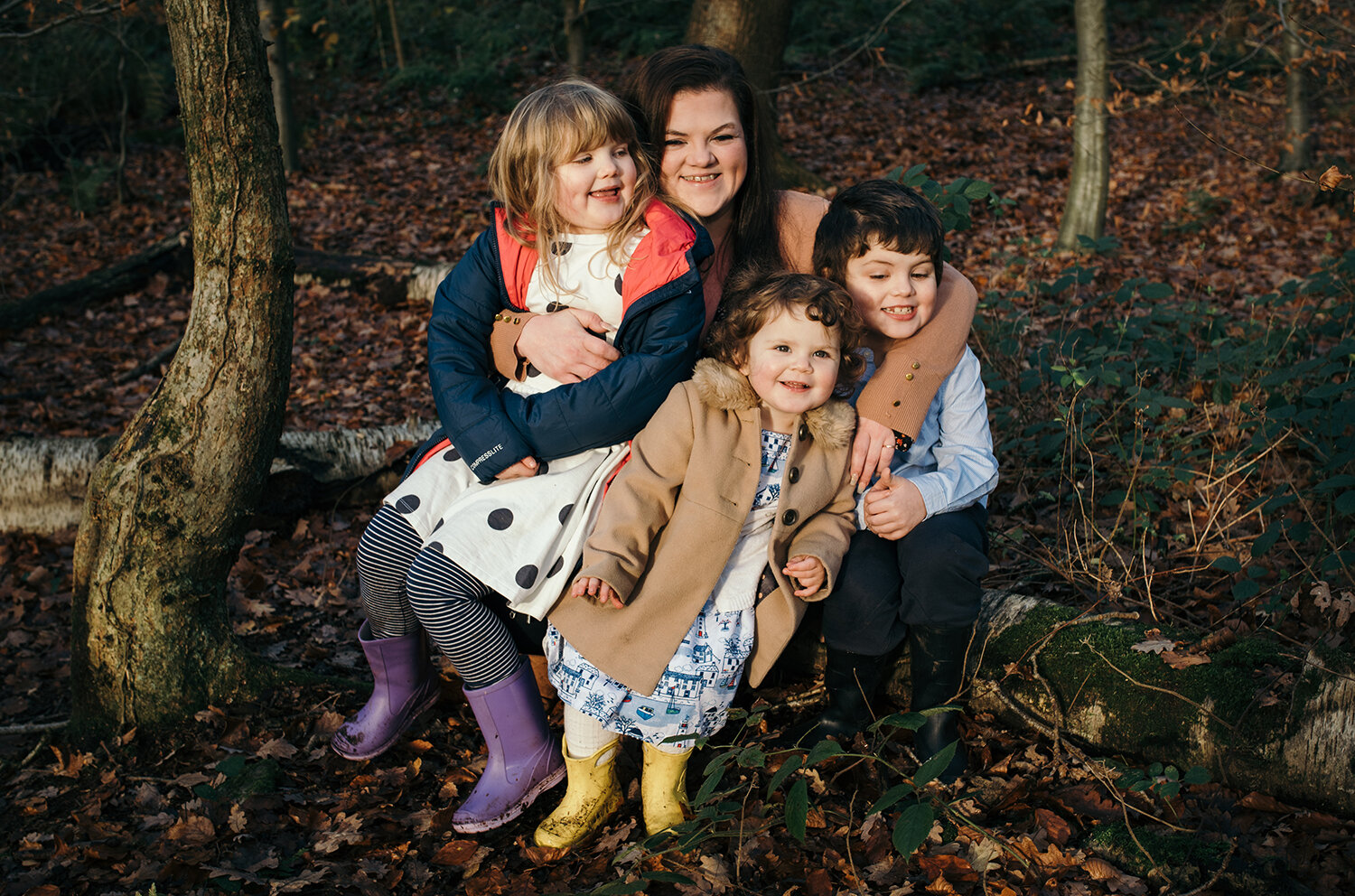 Mum and the kids portrait in the woods