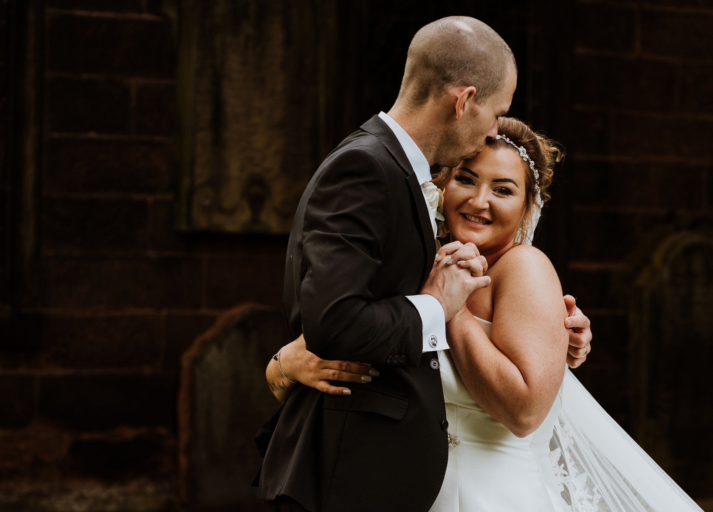 Bride and groom hugs