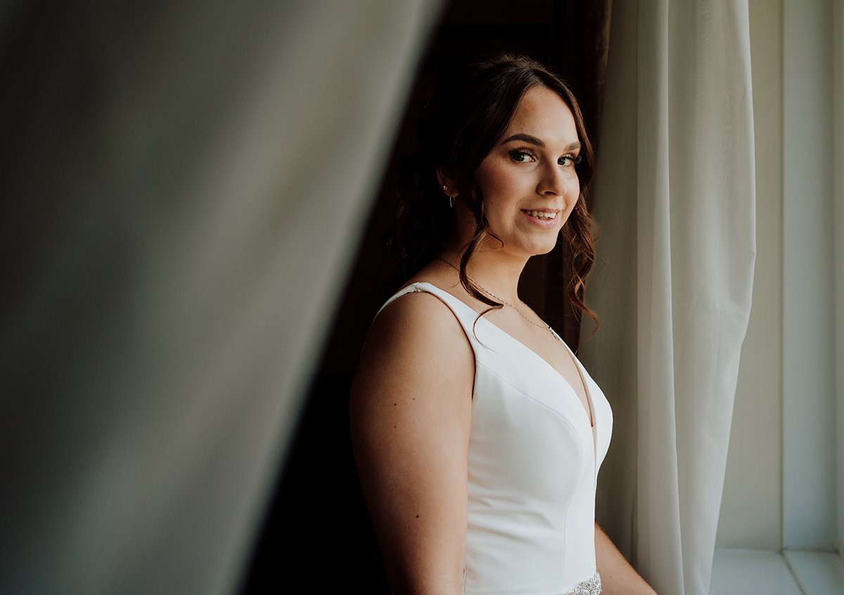 Brides portrait image in the window for nice lighting