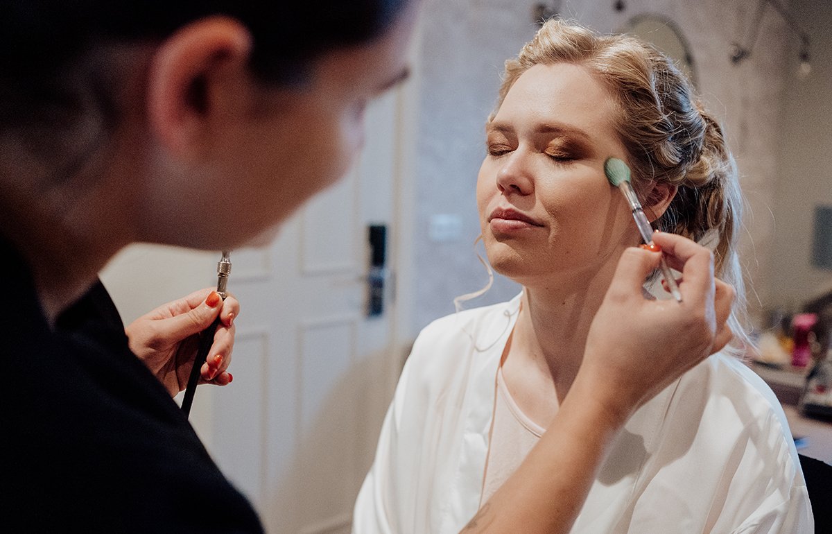 The bride having make up done