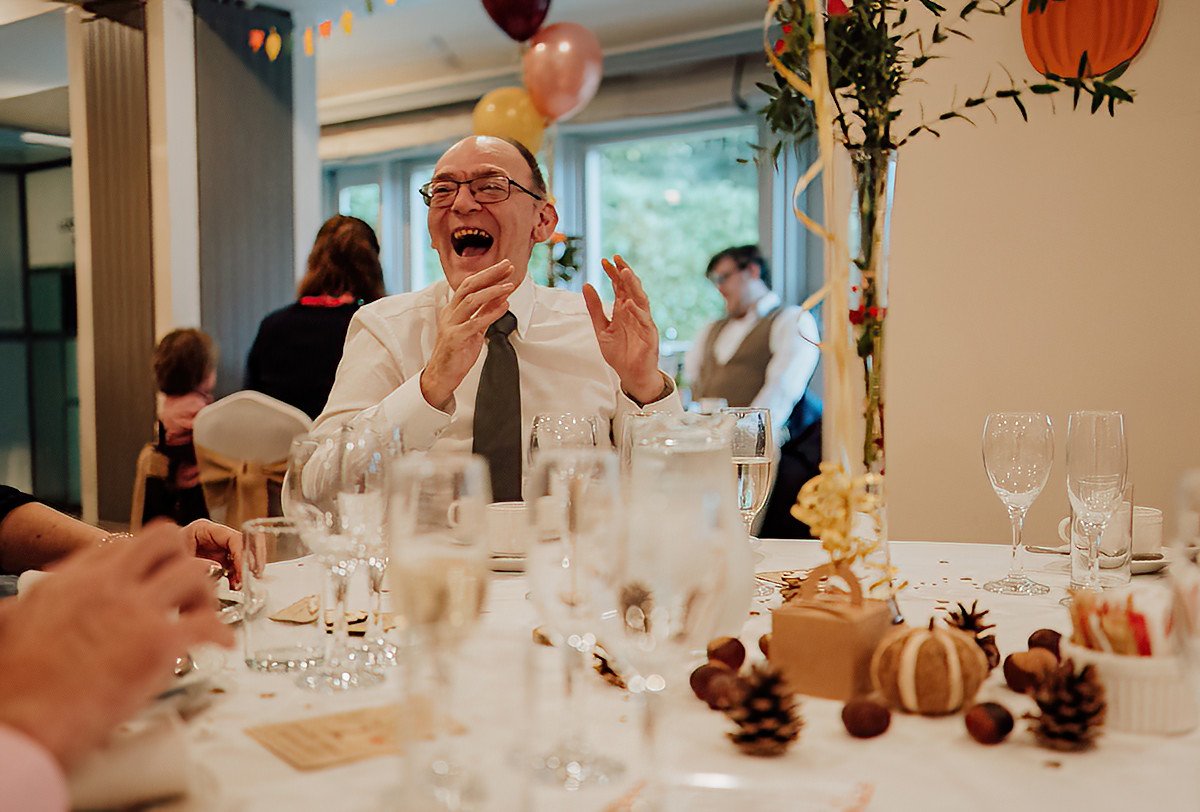 A guest having a laugh during the speeches