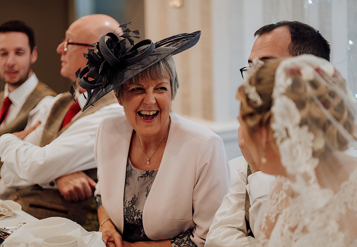 The brides mum laughing with the bride