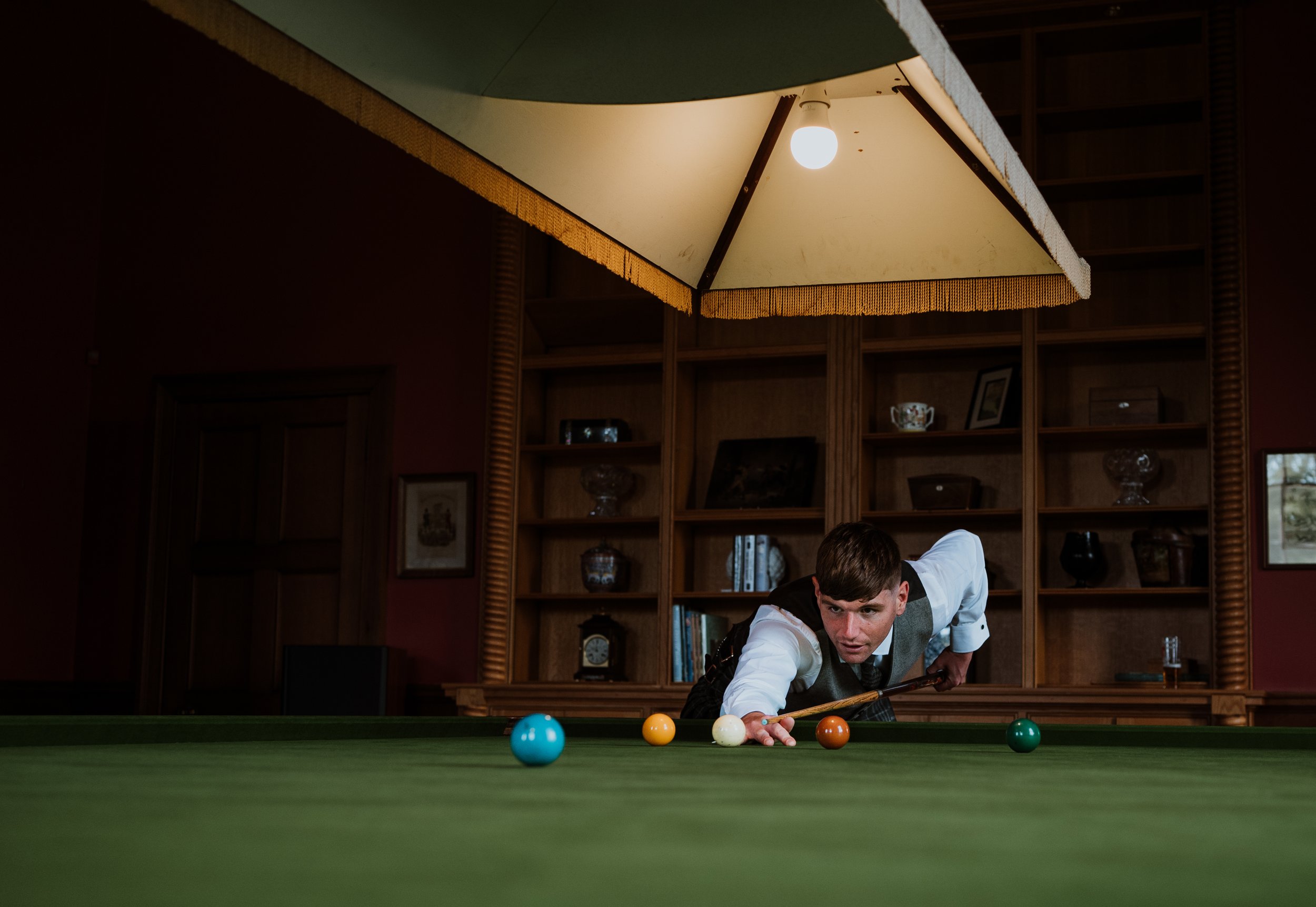 Groom playing snooker at Kinmount House