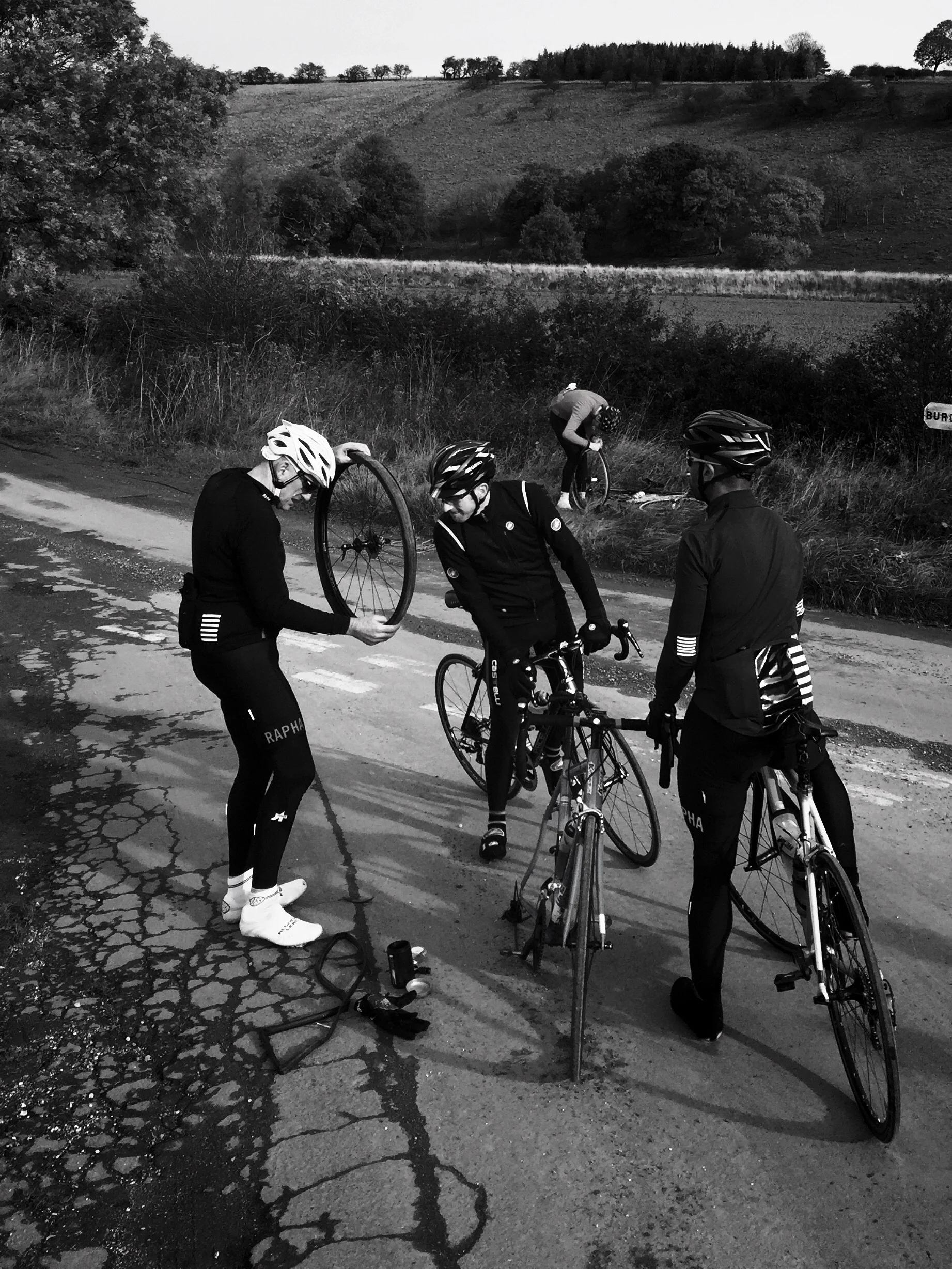 Puncture, and another puncture in the background. There were 10 punctures within four miles for this group.