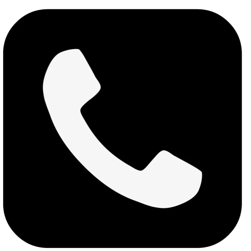 Icon of a white telephone receiver on a black background.