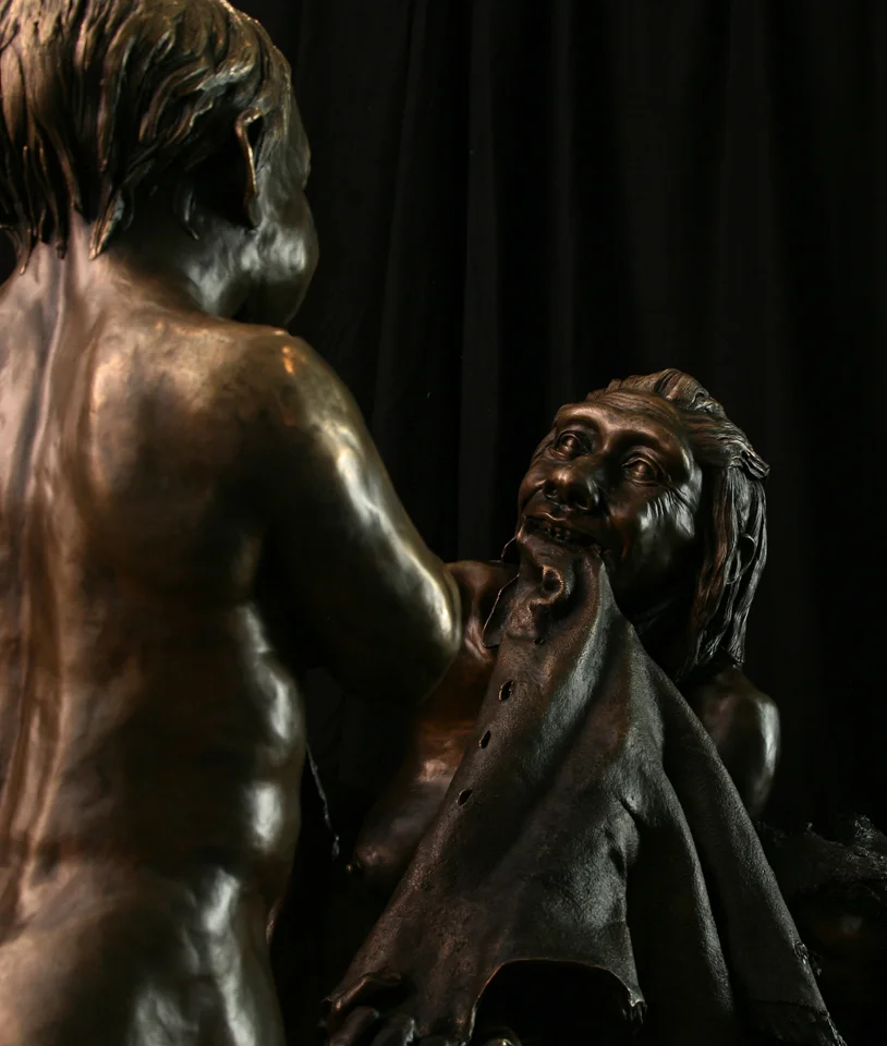 Image 802 Neandertal mother and child Smithsonian bronze.jpg