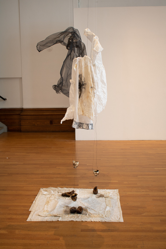 Holy Ordinary, 2018. Linen, paper, window screen, iron, tea leaves, gold leaf, wire, other various media. Size variable. 