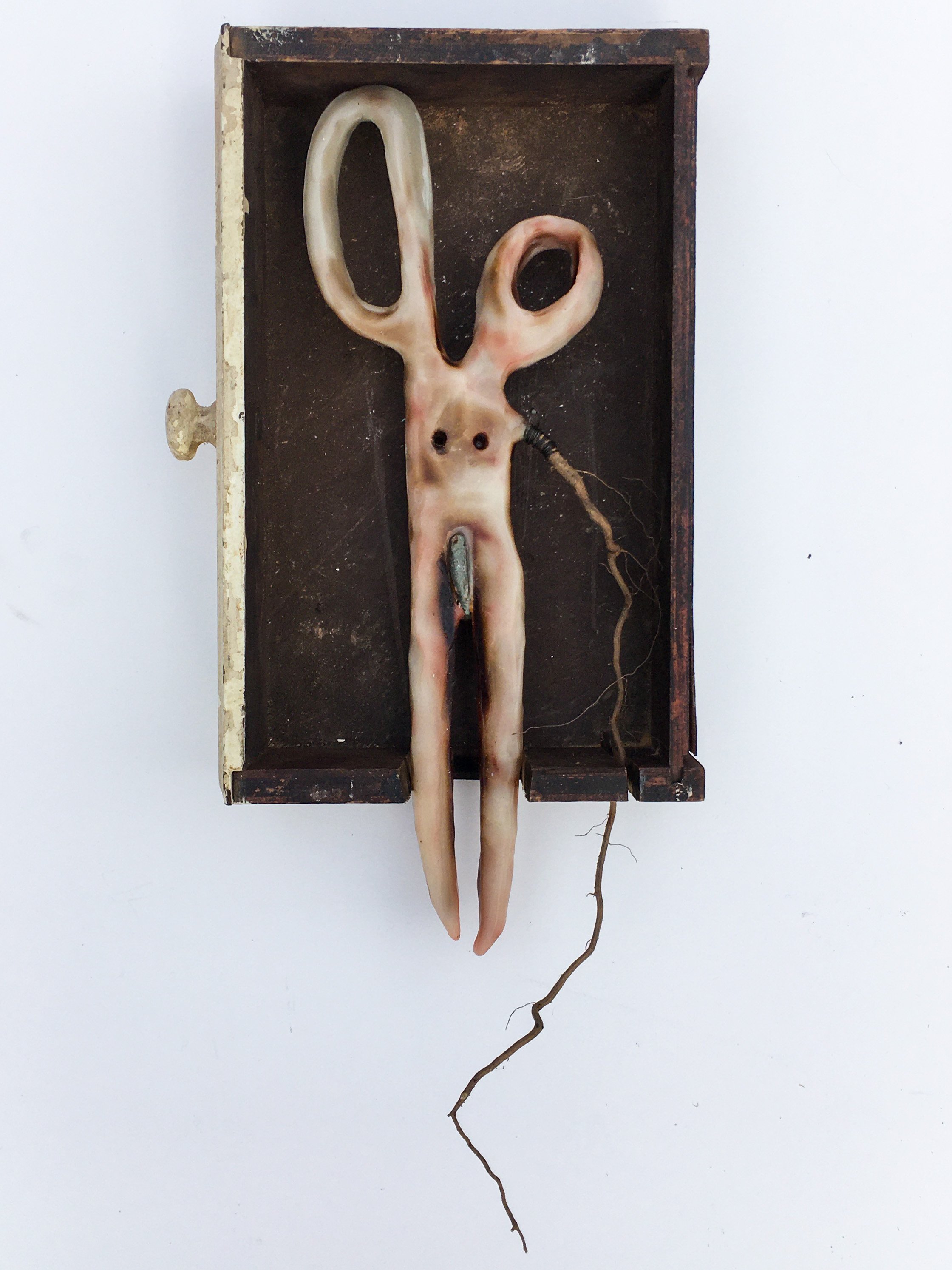   Birth , 2020. Wax, wire, stone, plant root, wooden drawer. 12” x 6” x 1.5” 