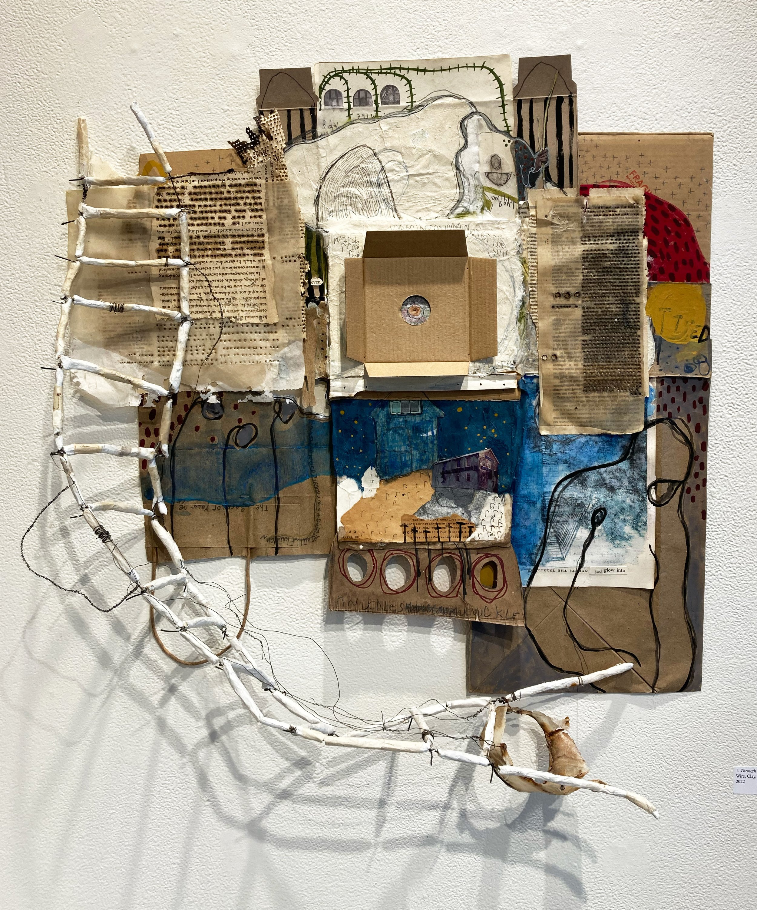   Through Language , 2022. Paper, packaging, paint, graphite, clay, wire.  