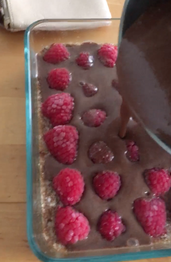Pour choc-fudge mixture over raspberries and place in fridge to set