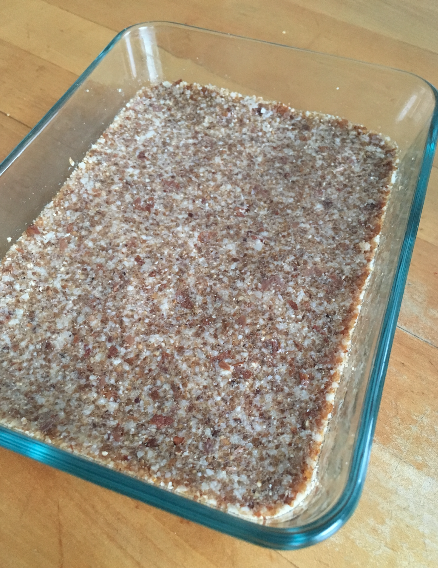 Press firmly into container and flatten with the back of a spoon