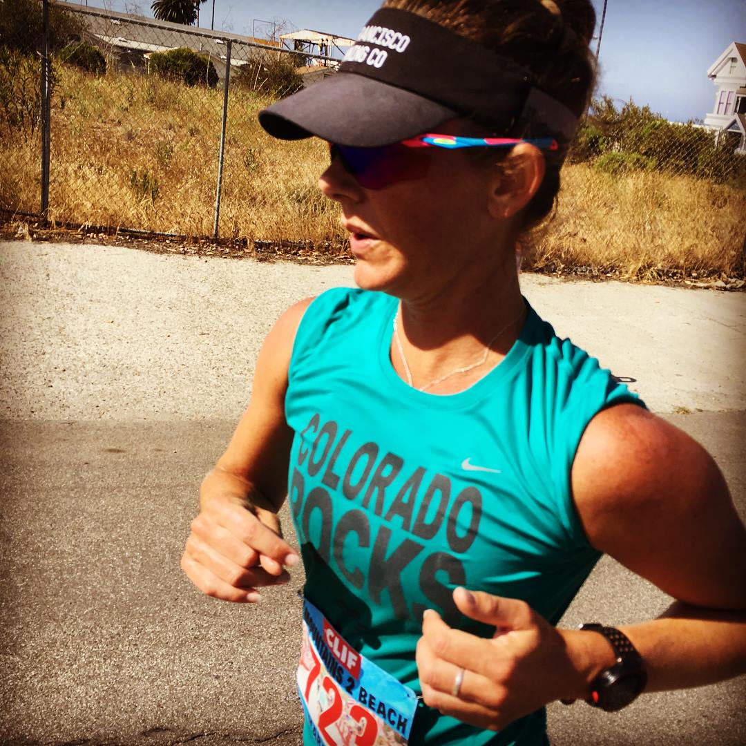 My athlete and sister, Sarah Fox cruising through mile 24 of the Mountains to Beach marathon, 2017. 