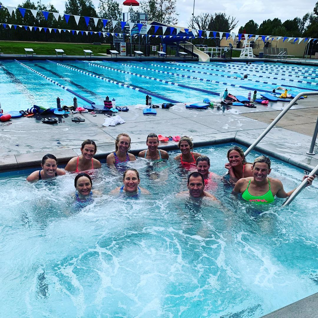 My TeamSFQ teammates and SmashfestQueen founders, Hillary Biscay in green, Michele Landry shooting the photo, enjoying a well-deserved hot-tub soak after completing our 100x100’s New Year’s Eve Swim workout. Photo courtesy of Jennifer Kenney Plumb