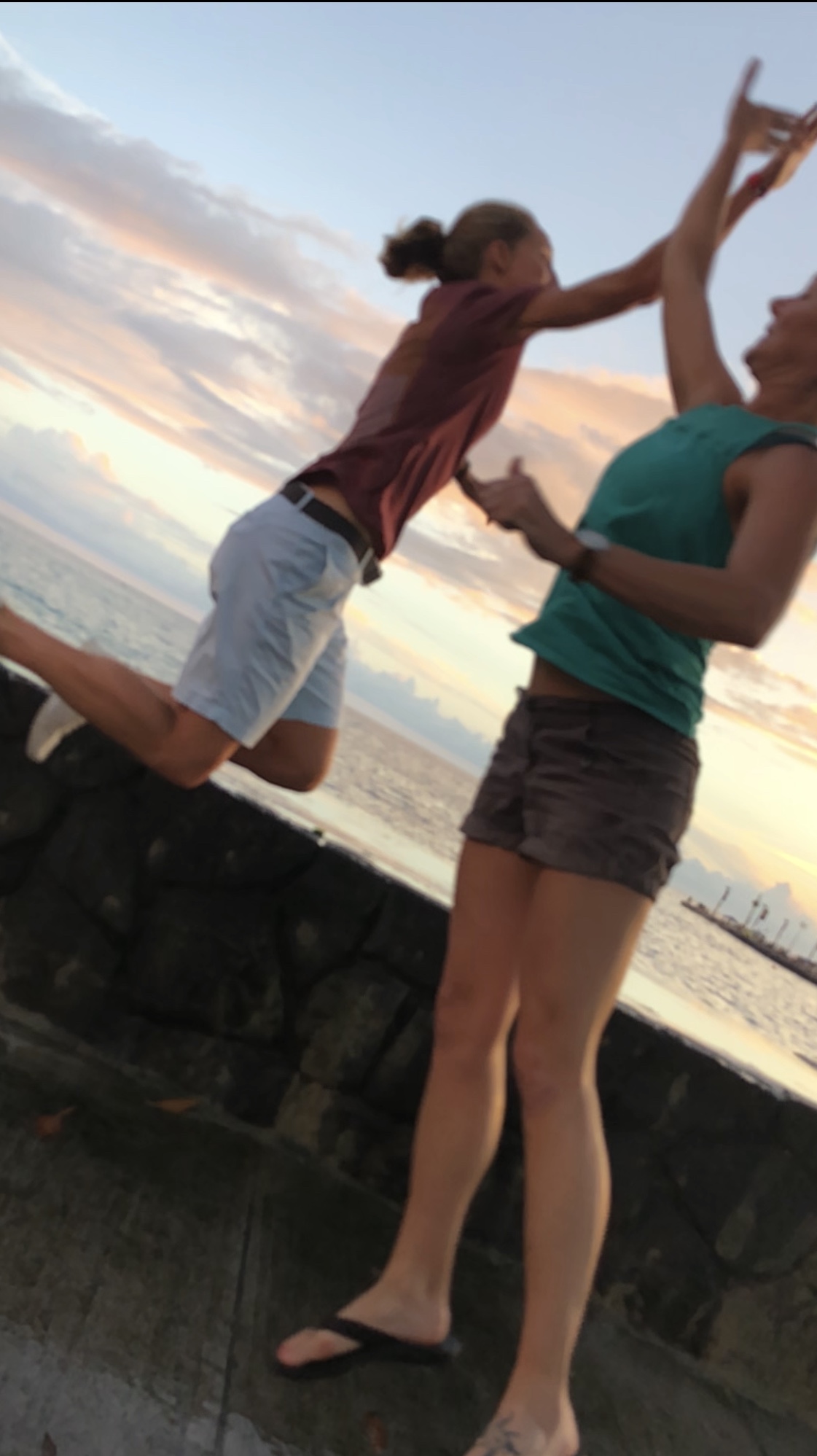 Hawaiian sunset high-five with my sister and team captain, Sarah Fox.
