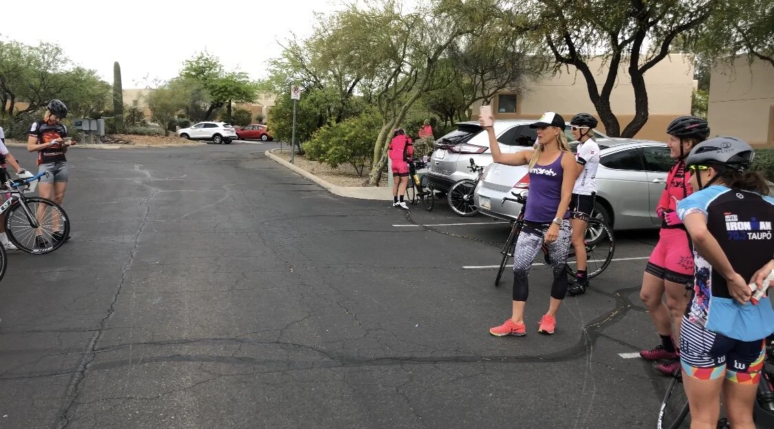 Hillary in her element, leading us through a pre-BIG ride chat at Smashfest Camp in Tucson, 2019.
