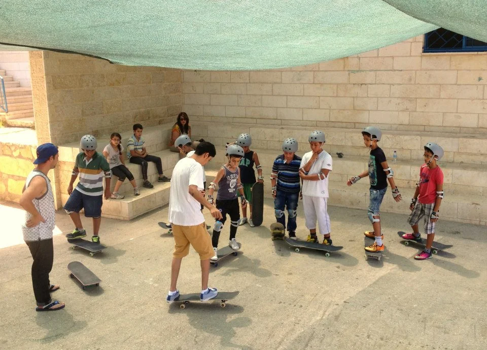 Aram & Charlie teach the basics during skate classes in Ramallah, 2014.