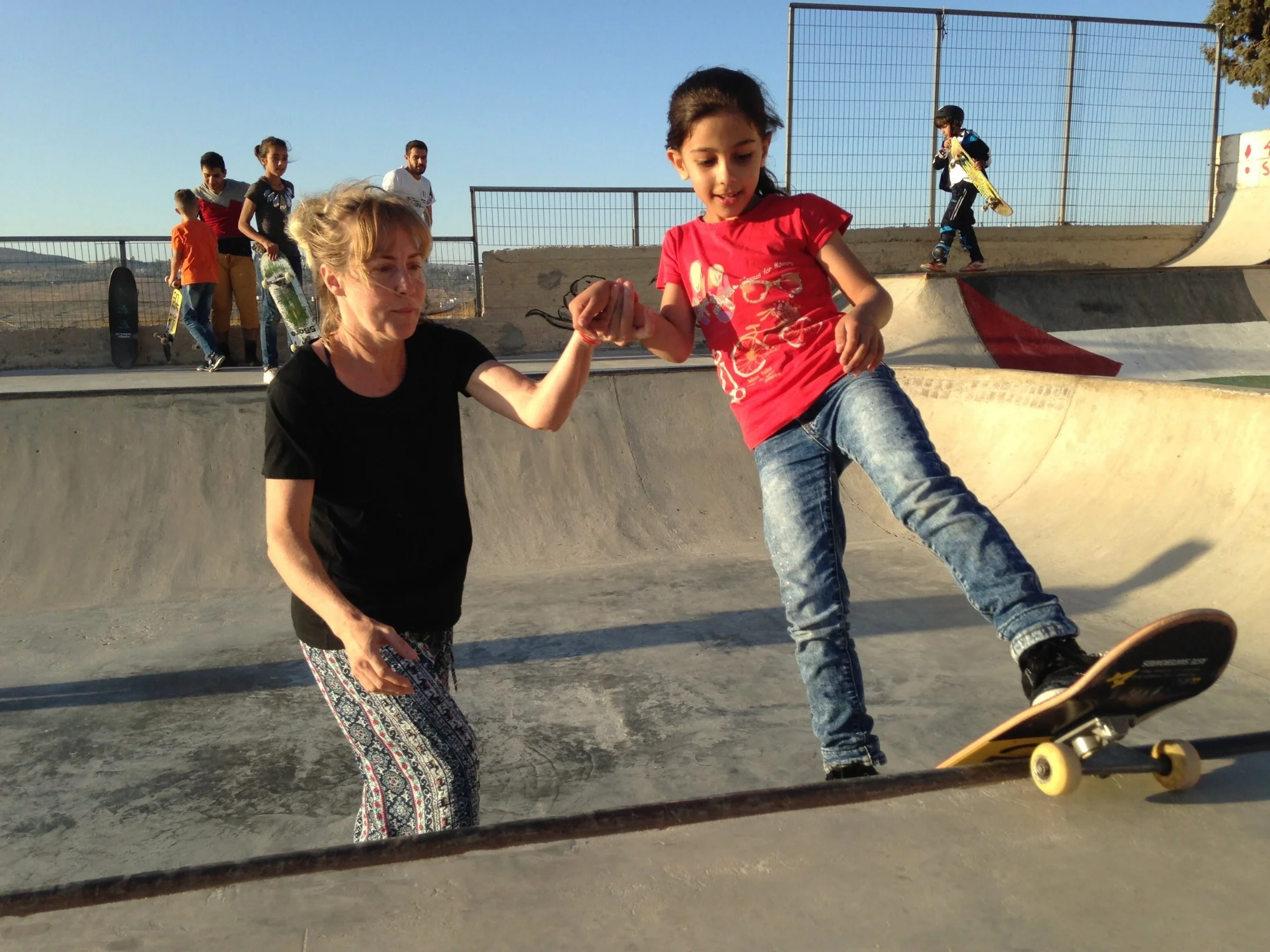 Kristi lends a helping hand to Lydia's rock-fakie.