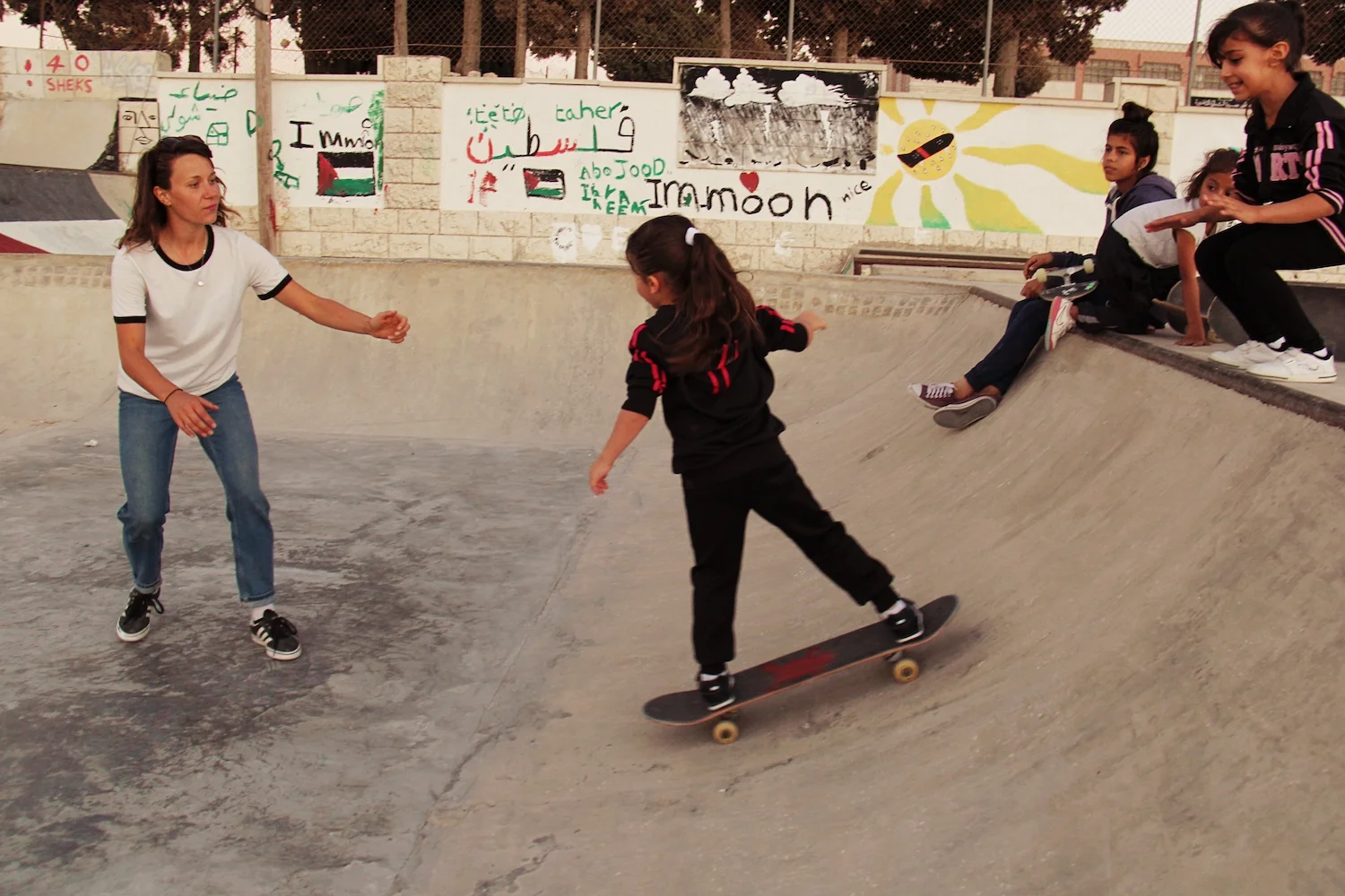 Ruby teaches Esinat to drop in. Asira Al-Shamaliya, 2016.