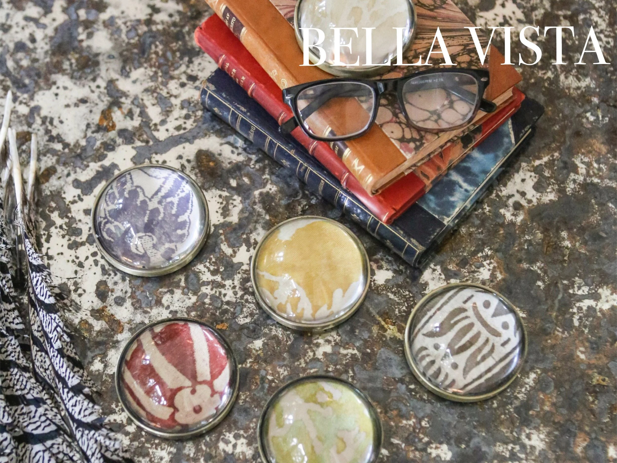HEAVY BRASS AND GLASS HIGHLIGHT THE DETAILED ARTISTRY OF OUR COLLECTION OF LIMITED RUN FORTUNY FABRIC. PAPERWEIGHT MEASURES 3"X3". AVAILABLE IN 8 COLOR/PATTERN WAYS. GIFT BOXED. 