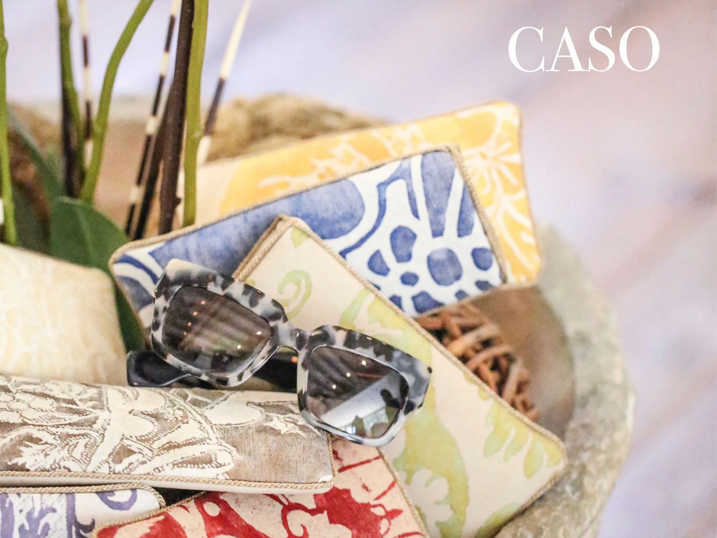 KEEP EYEWEAR CHIC AND HANDY. EACH CASE HAS A UNIQUE FORTUNY FABRIC FRONT, BONE COLORED GENUINE LAMBSKIN BACK AND IS FINISHED WITH IMPORTED TRIM. MEASURES 3.5"X7". AVAILABLE IN 15 COLOR/PATTERN WAYS