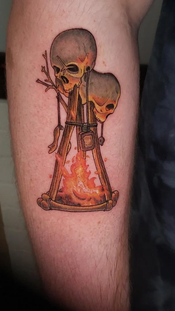 Skull and campfire tattoo by Rey