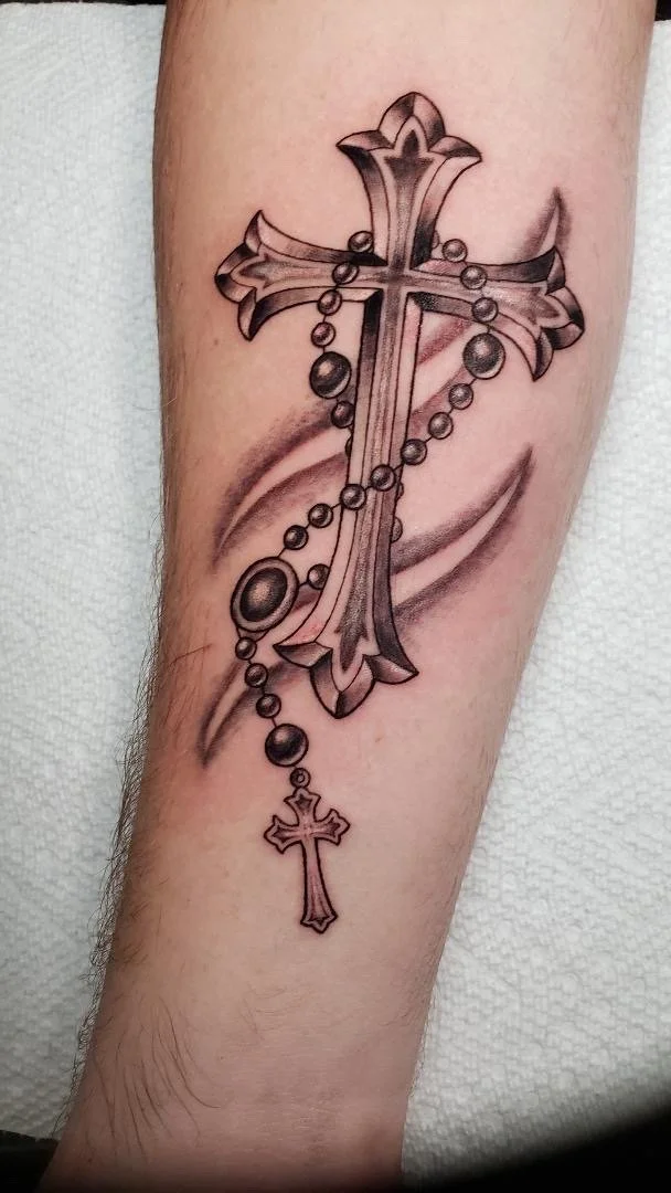 Cross and rosary tattoo by Rey