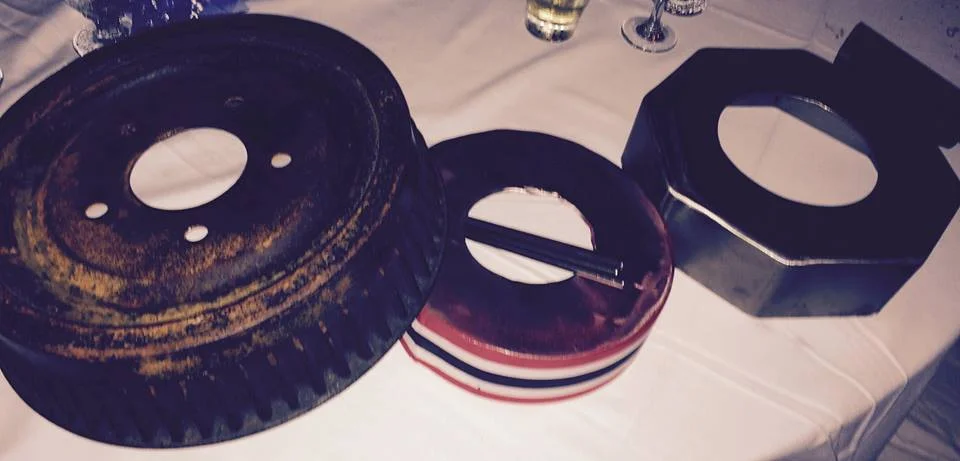 In Trinidad, these metal instruments (brake drums) are used as part of the rhythm section in the big steel bands. This picture is from a 60th birthday party for the father of one of Mark's students. The family and most of their friends were from Trinidad. It was really exciting when a couple of them pulled these out of the trunk of their cars and brought them in to play along with the band. 