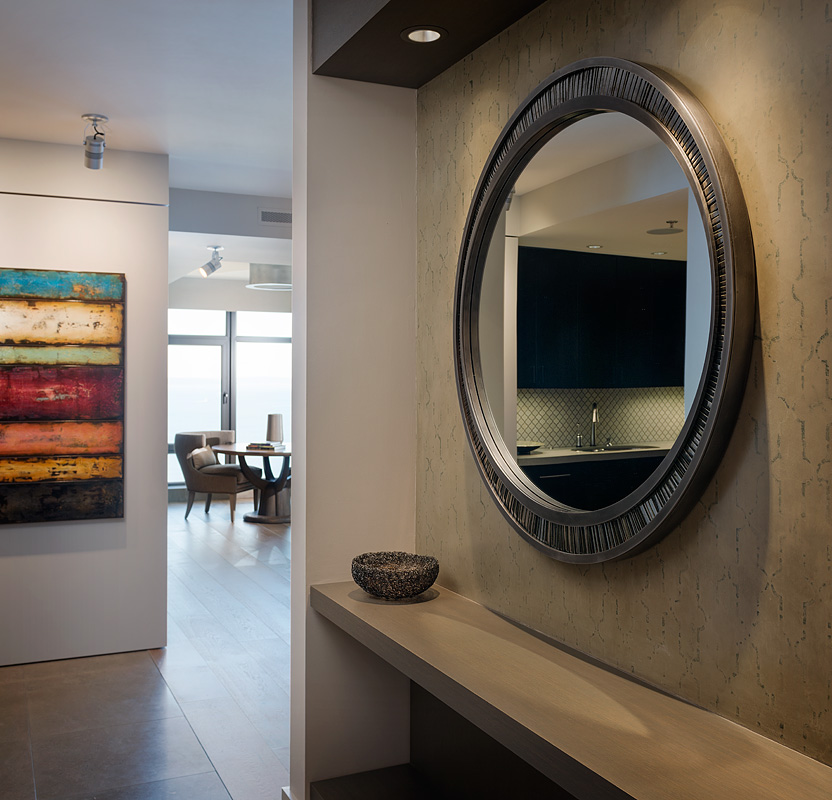 Modern Seattle condo remodel with custom mirror, plaster, tile and hardwood floors