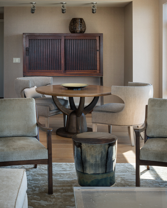 Seattle Custom Living Room Design with cool table unique light fixture and architectural chairs