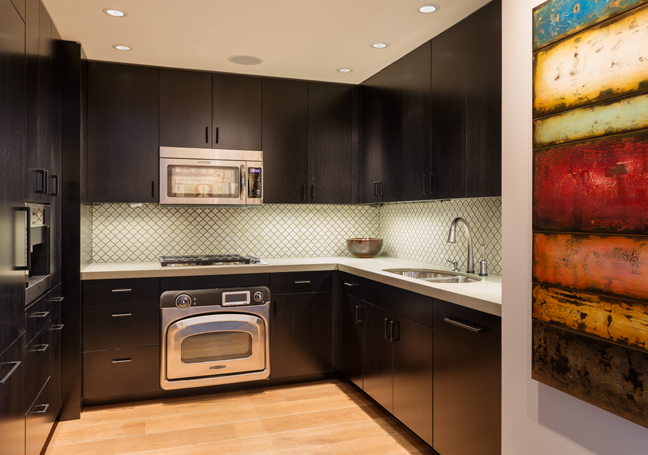 Modern Seattle Kitchen Remodel with cool splash, dark cabinets and hardwood floors