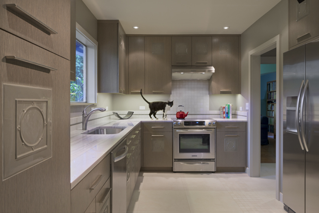 Seattle Kitchen Remodel with new back splash, counters and custom inlay oak cabinets and a cat on the counter