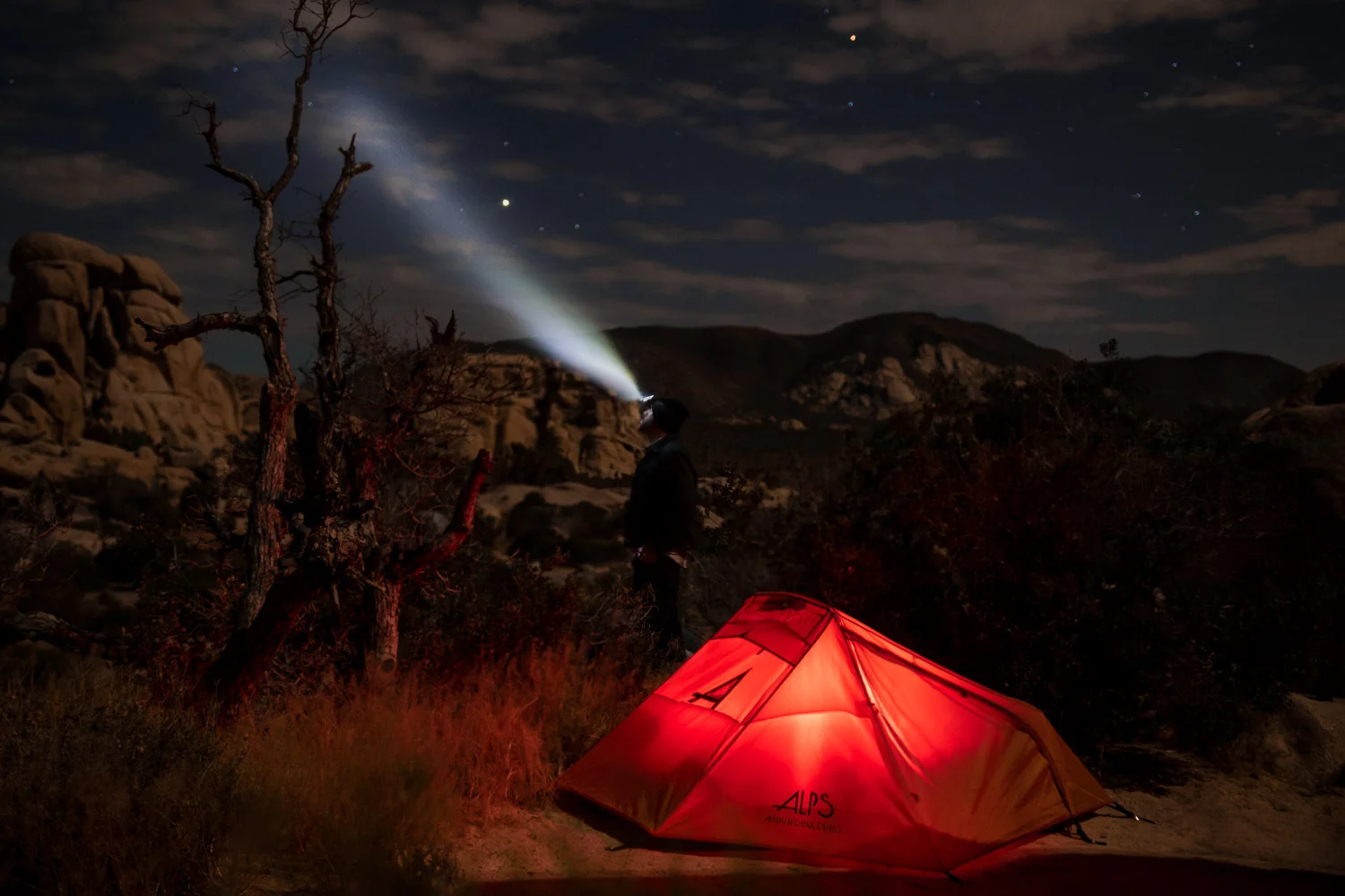 Alps tent lit up at night