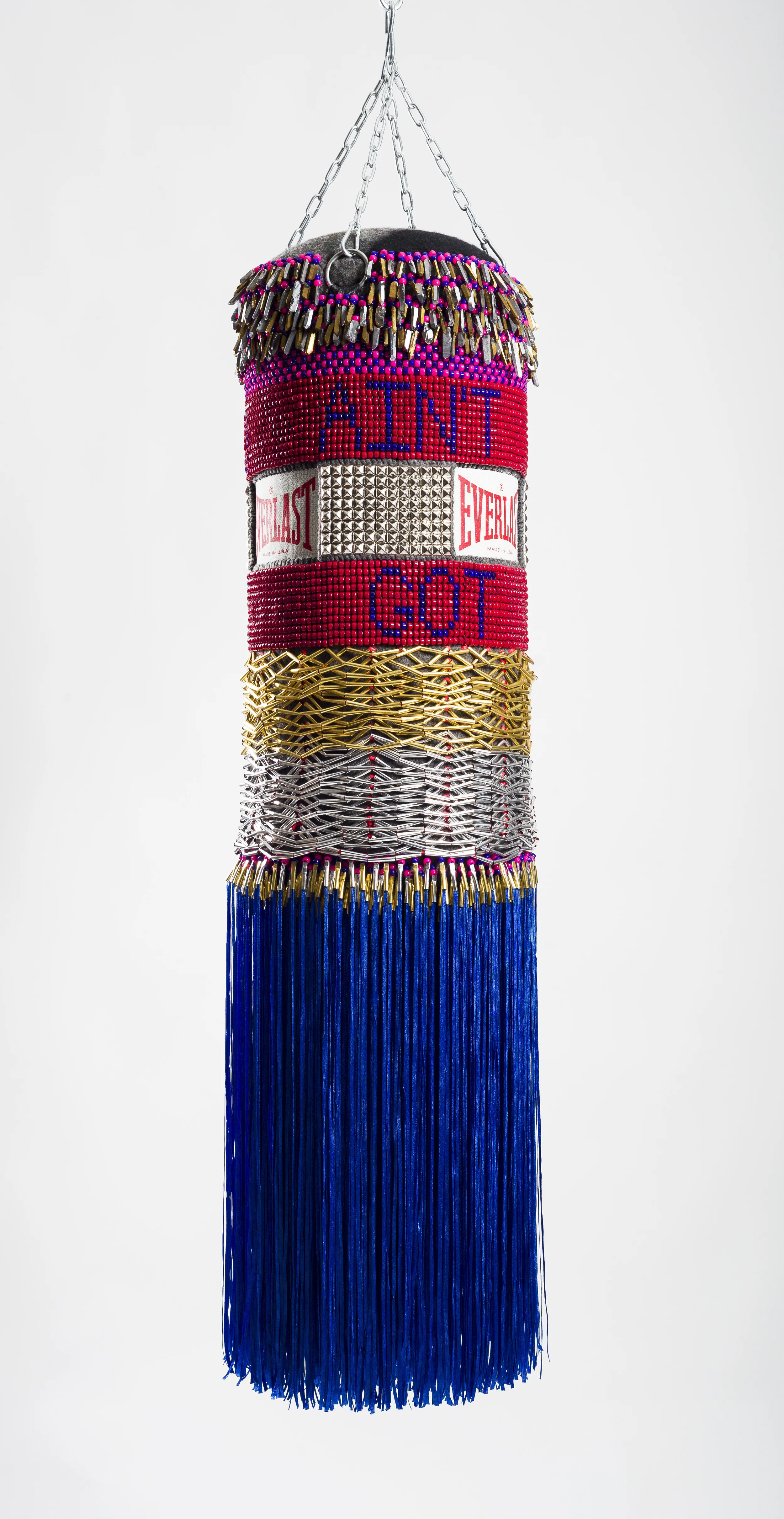 Jeffrey Gibson Ain't Got No, I Got Life, 2014 Found Vinyl punching bag, repurposed wool army blanket, glass beads, plastic beads, steel studs, acrylic yarn, artificial sinew, nylon fringe, metal cones, quartz, crystals, steel chain 55 x 15 x 15 inches Courtesy of the Artist