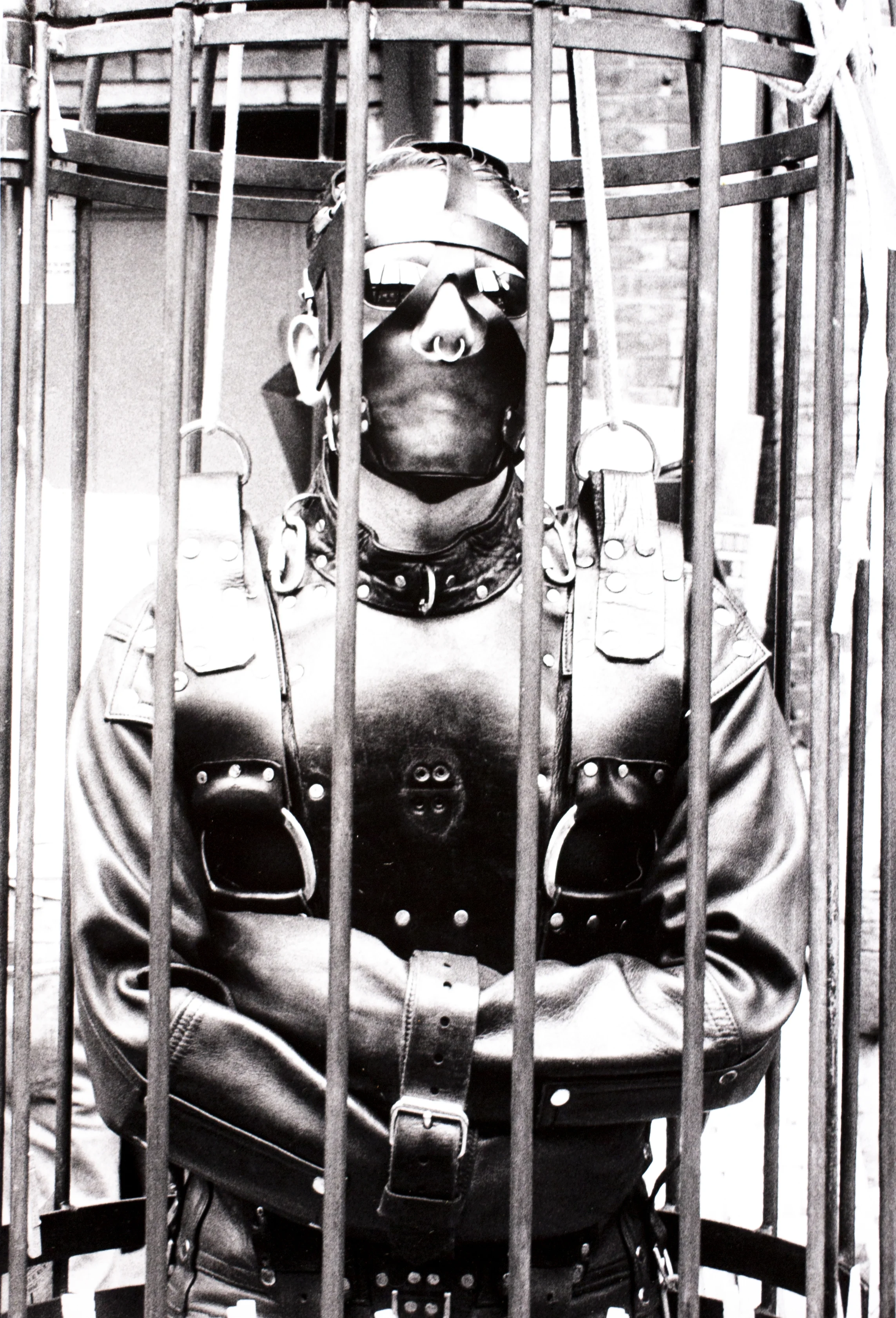 Efrain John Gonzalez Folsom Street East Festival on 13th Street Bondage in Cage Silver gelatin print 10 x 8 in.