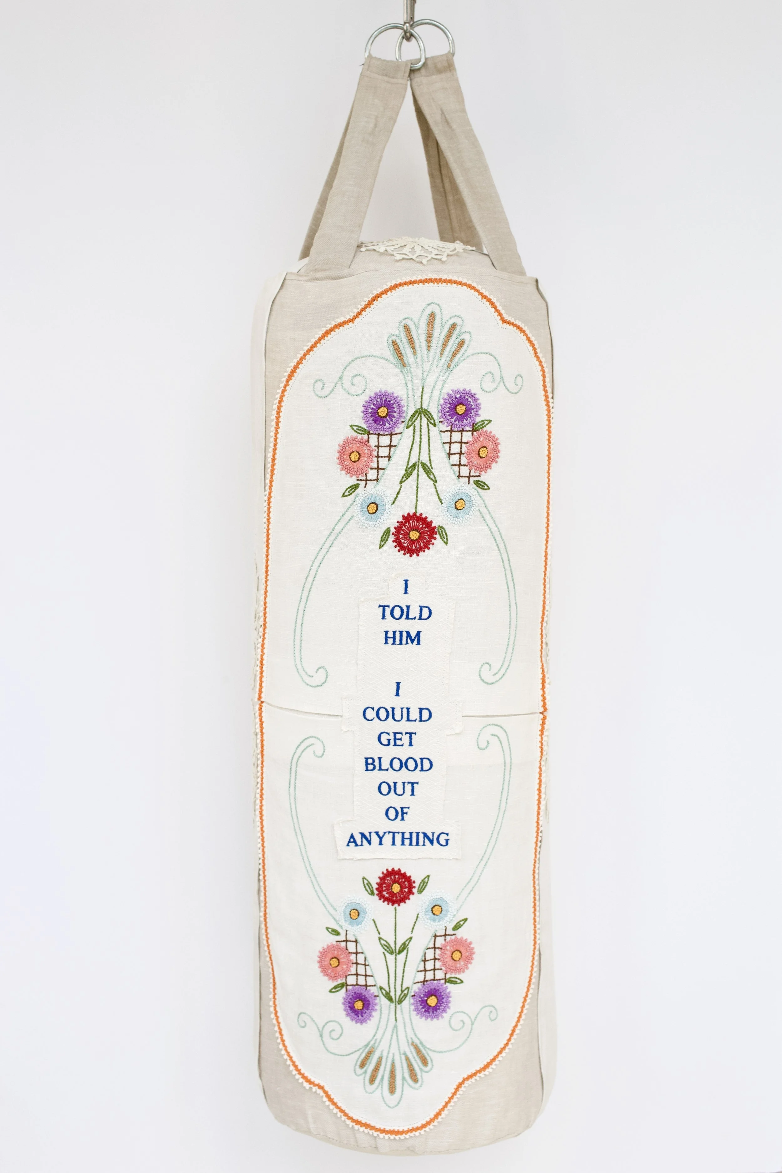Zoë Buckman Heavy Bleach, 2019 Punching bag, embroidery on vintage linen tea towels, chain 46 x 13 x 13 1/2 inches