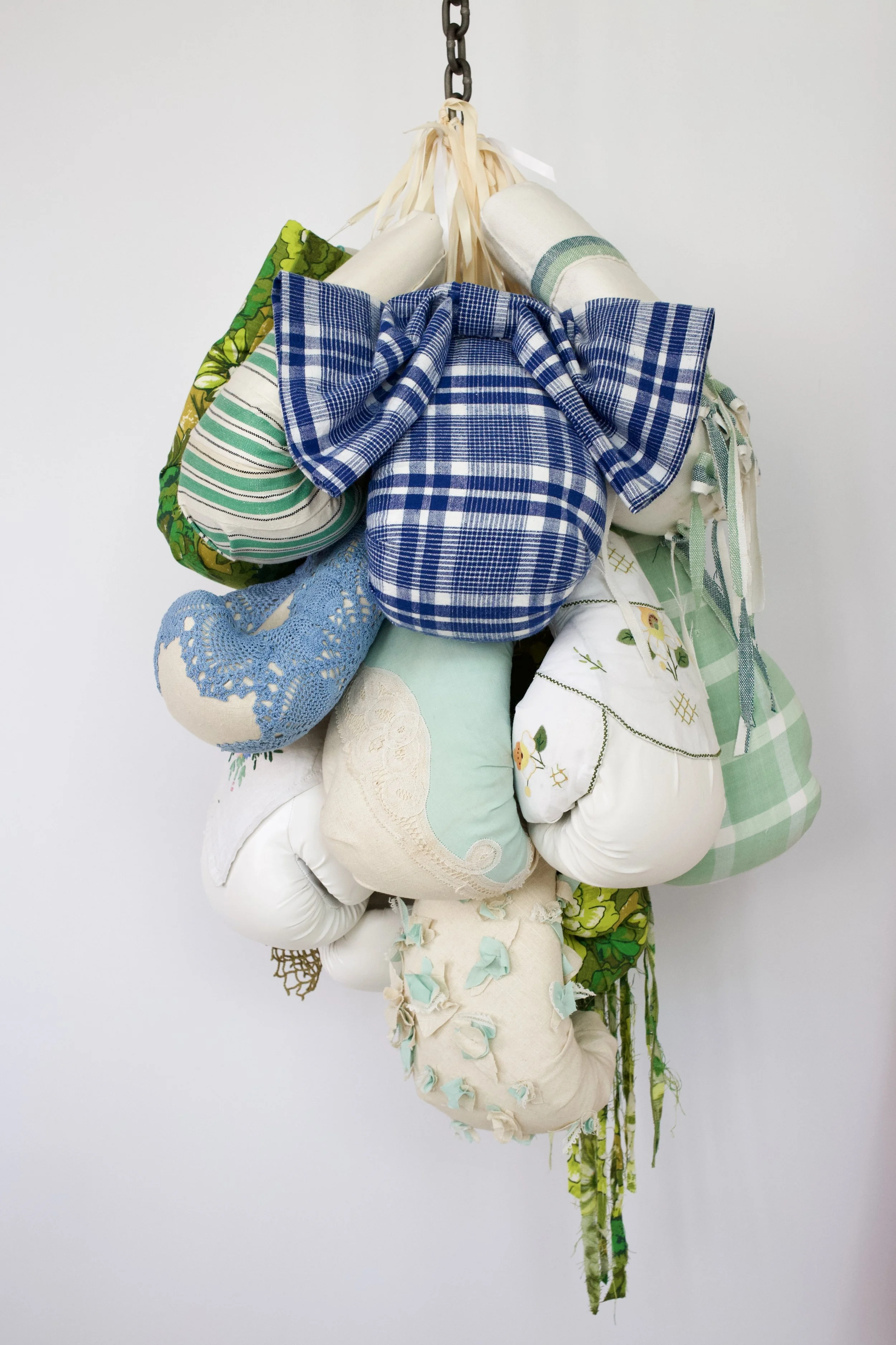 Zoë Buckman His Eyes Narrowed, 2019 15 boxing gloves, vintage linen, chain 39 x 21 x 17 inches