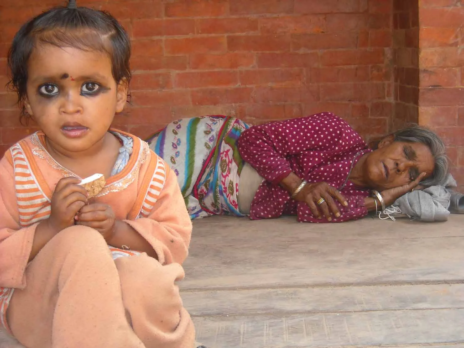 Bhaktapur - Child and sleeping grandmother.jpg