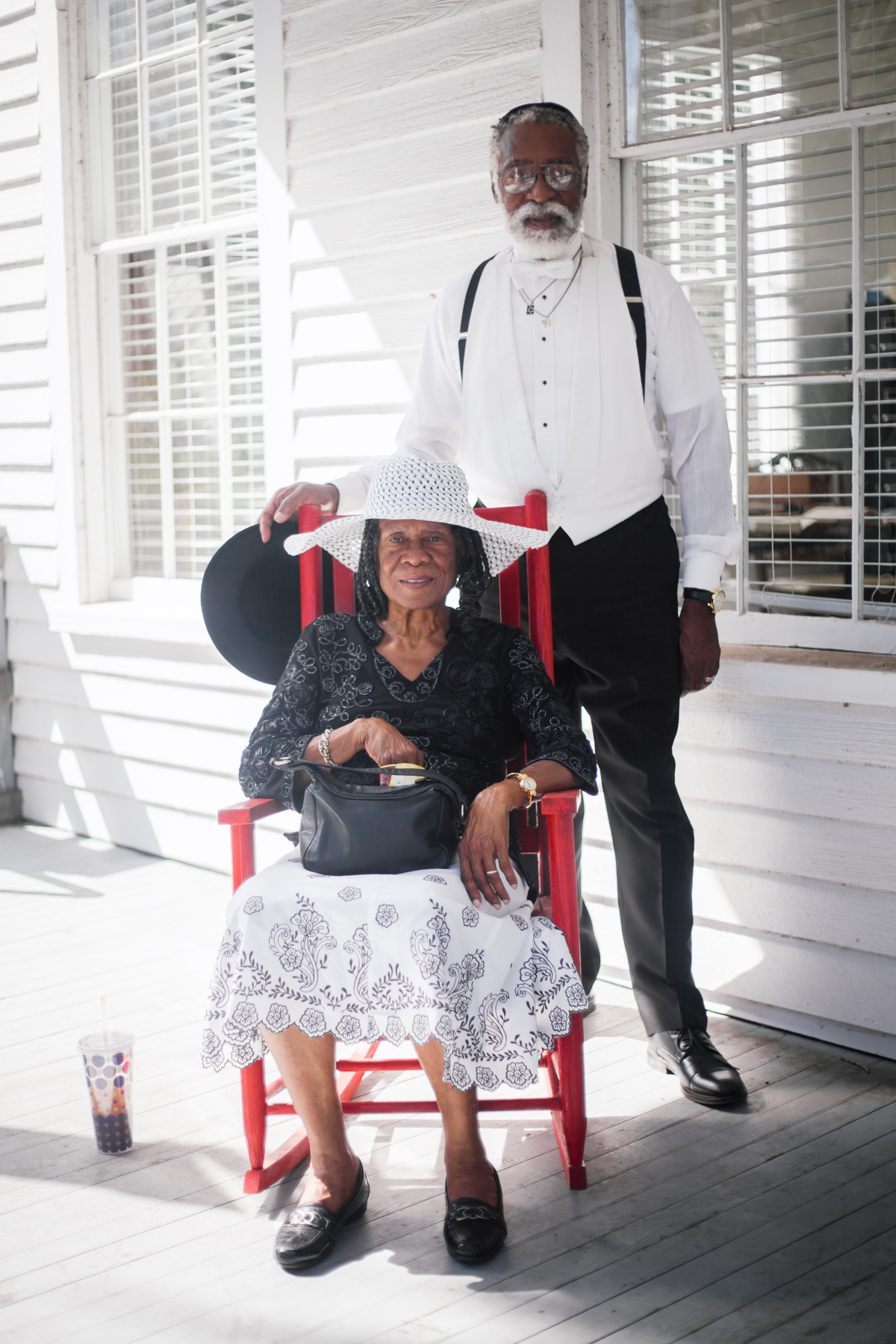  Dr. Collins serves as the chairman of the McIntosh County Historic Preservation Commission. Here, he poses for a portrait with Mrs. Eunice M. Moore, a board member of the commission, on the porch of the Burning of Darien museum that houses his offic