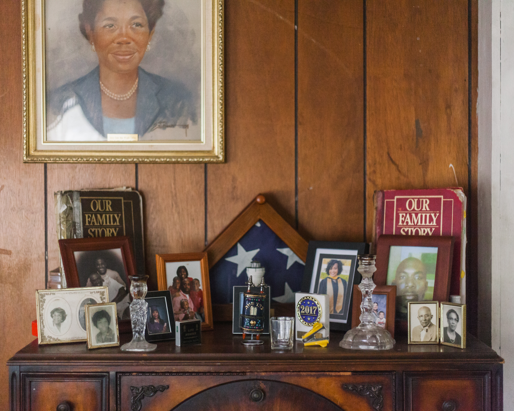  Dr. Collins is a history buff and keeps records, newspaper clippings, certificates, and other documents that he displays around his home. There are also many portraits of family members; pictured here is his aunt who raised him. 