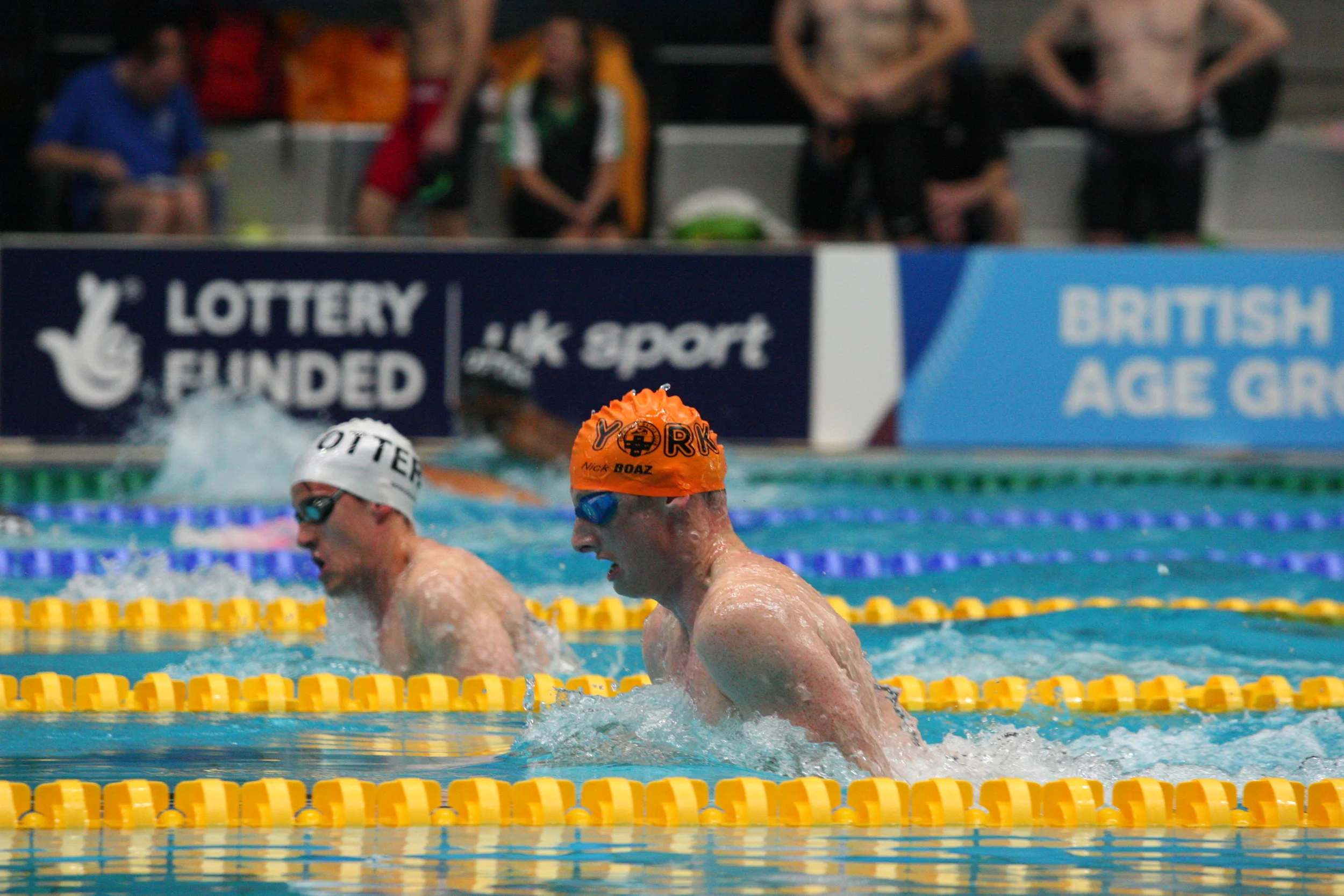Craig wins gold in white for Otter in the 200 Breast. 