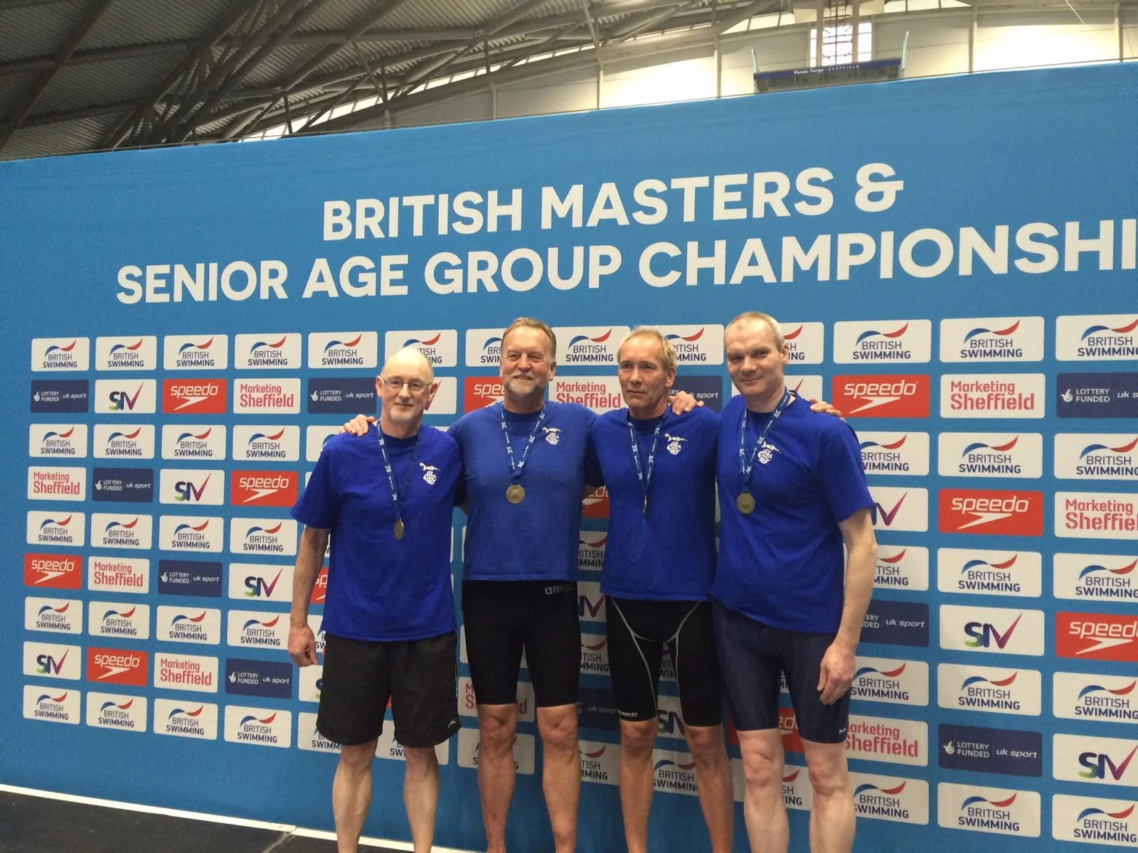 Stephen, Peter, Peter & Paul collecting their British Record medals for the 4x200m Freestyle record