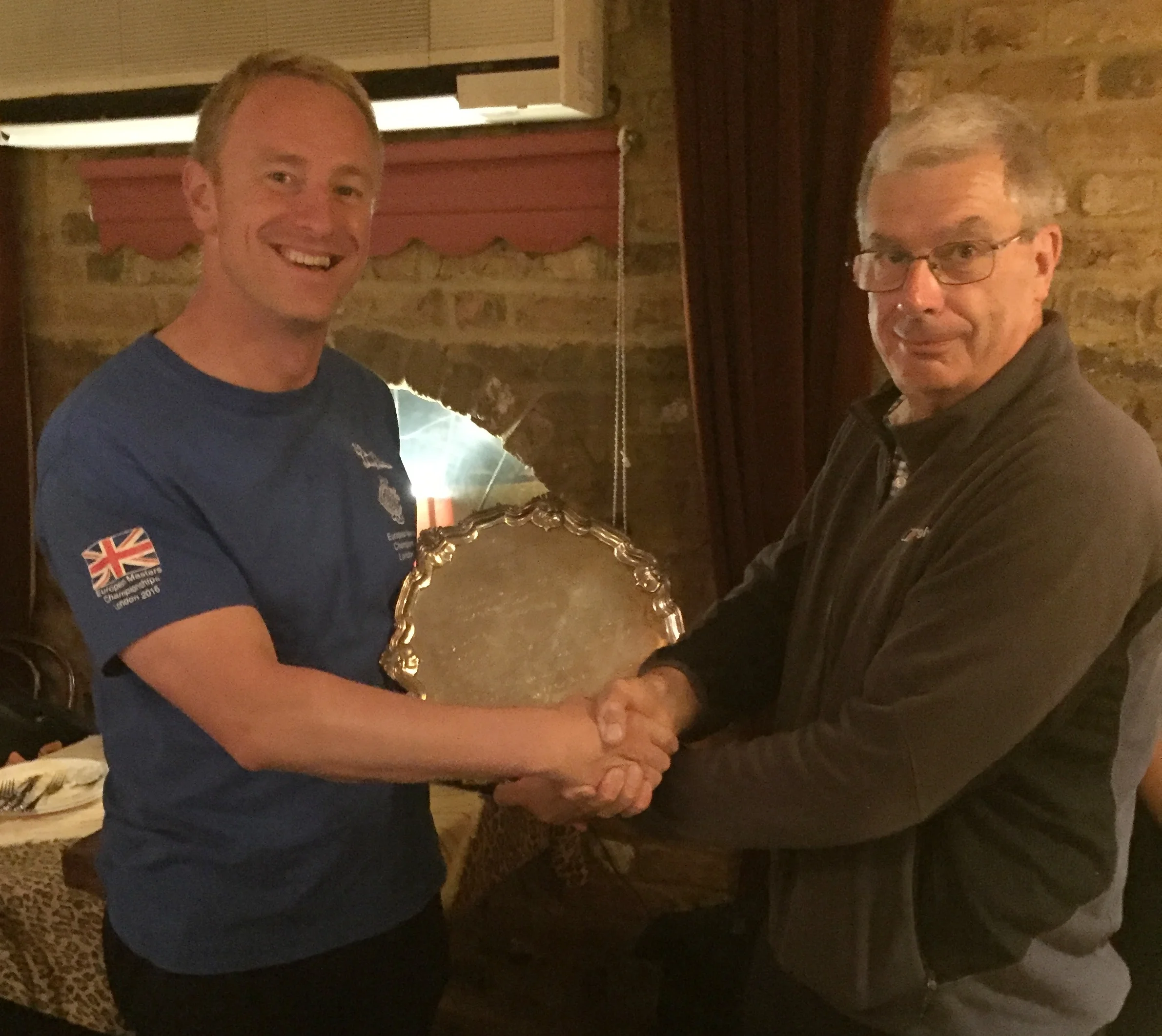 Mile Handicap winner Mike Reys receiving the trophy from President, Paul Hindle
