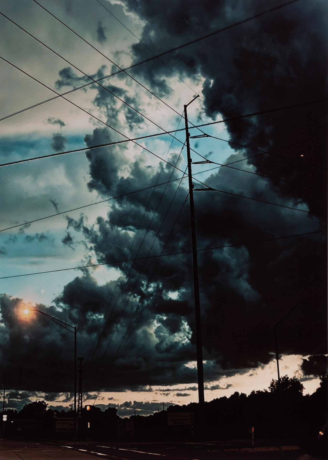 <strong>Elijah Putt</strong><br>Messy Clouds Over a Highway</br>